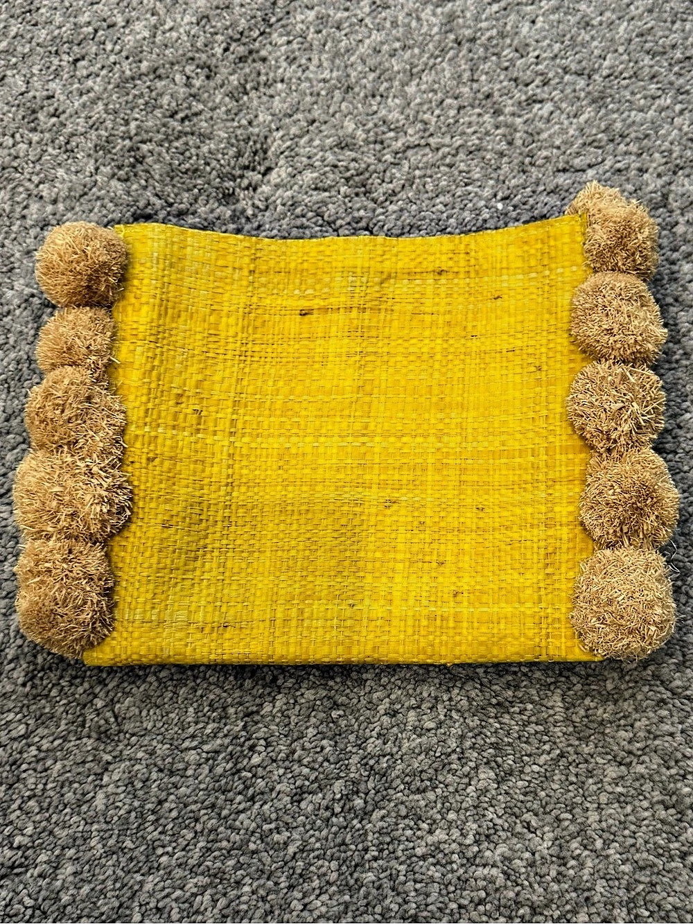 hatattack Raffia Pom-Pom Clutch in Yellow